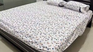A bedroom with a bed, a wardrobe, and a nightstand. - Independent floor for rent in Hyderabad (Hayathnagar_Khalsa)