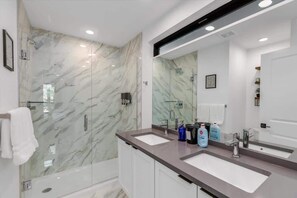 Shower, eco-friendly toiletries, hair dryer, towels