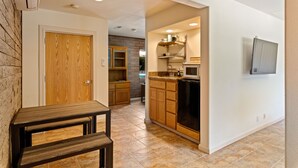 A modern kitchen with wooden cabinets, a built-in oven, and a microwave. - Clearlake Studio | Shared Pool + Boat Parking (Clearlake Oaks)