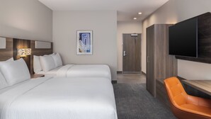 A hotel room with two beds, a TV, a desk, and a chair. - Holiday Inn Express And Suites Nacogdoches Southwest by IHG (Nacogdoches)