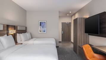 Ropa de cama de alta calidad y caja de seguridad en la habitación