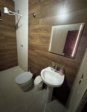 Bidet, towels, soap, toilet paper