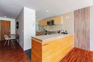 Fridge, microwave, stovetop, coffee/tea maker