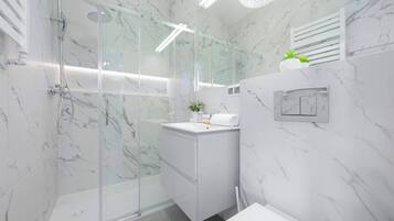 Shower, hair dryer, towels, shampoo
