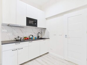 Fridge, microwave, stovetop, cookware/dishes/utensils