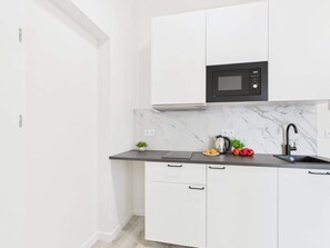 Fridge, microwave, stovetop, cookware/dishes/utensils