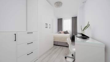 1 bedroom, desk, iron/ironing board, travel crib