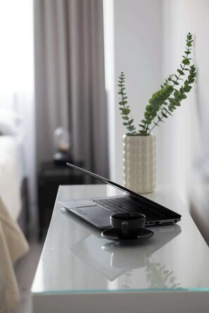 1 bedroom, desk, iron/ironing board, travel crib