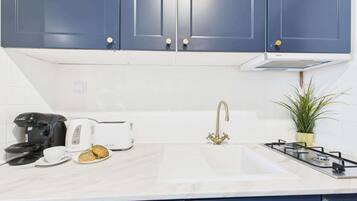 Fridge, microwave, stovetop, cookware/dishes/utensils