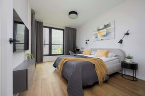 1 bedroom, desk, iron/ironing board, travel crib