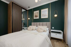 1 bedroom, desk, iron/ironing board, travel crib