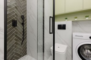 Shower, hair dryer, towels, shampoo