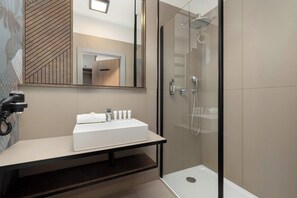 Shower, hair dryer, towels, shampoo