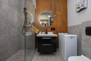 Shower, hair dryer, towels, shampoo