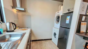 Fridge, microwave, electric kettle, cookware/dishes/utensils