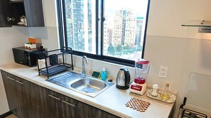 Fridge, microwave, electric kettle, cookware/dishes/utensils