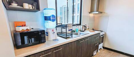 Fridge, microwave, electric kettle, cookware/dishes/utensils