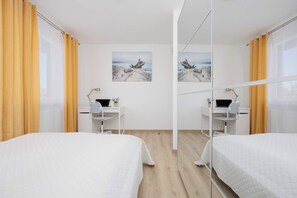 1 bedroom, desk, iron/ironing board, travel crib