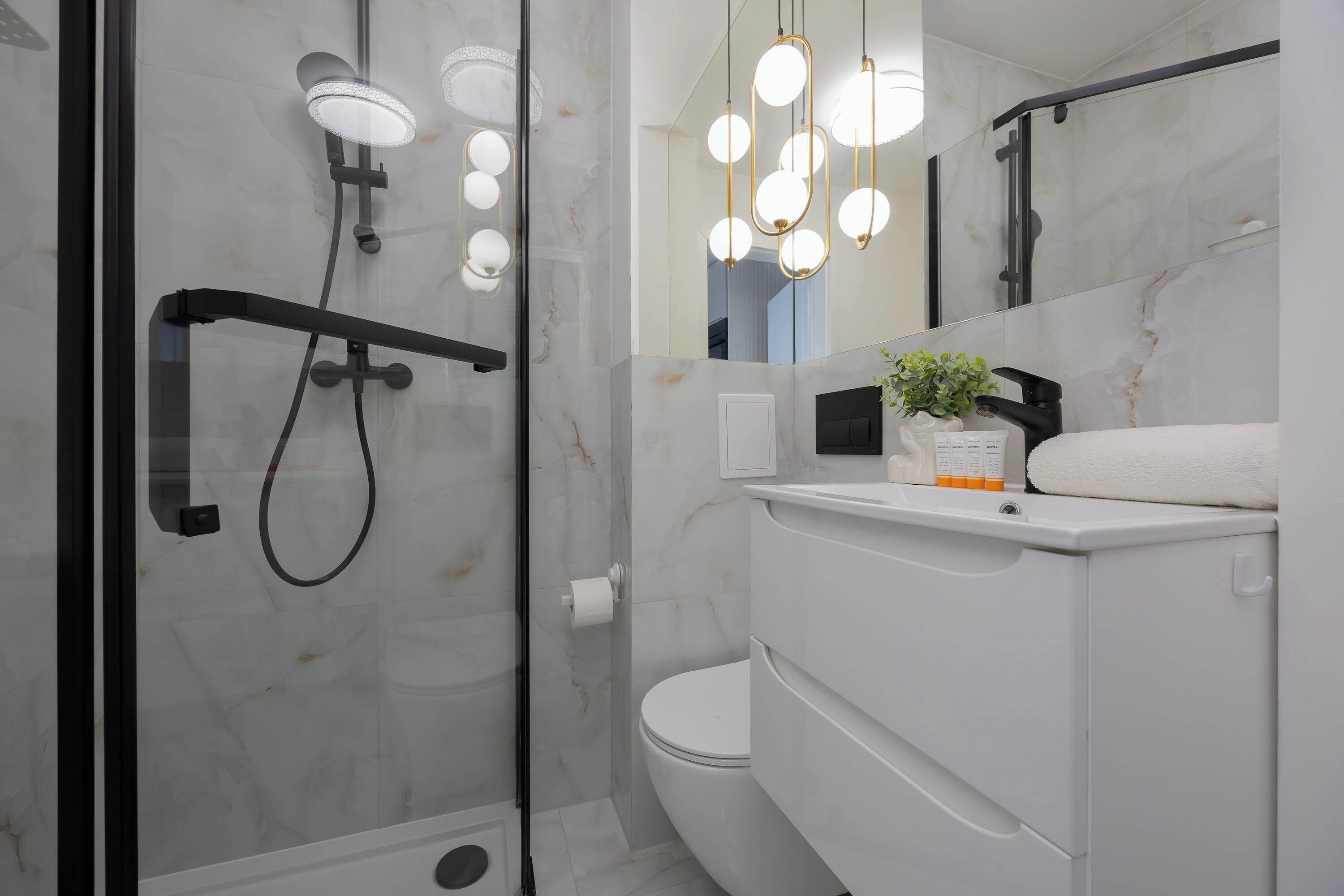 Shower, hair dryer, towels, shampoo