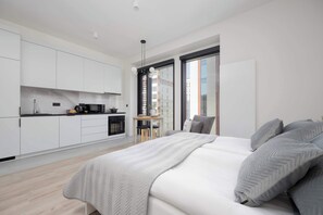 1 bedroom, desk, iron/ironing board, travel crib