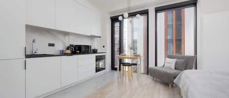 1 bedroom, desk, iron/ironing board, travel crib