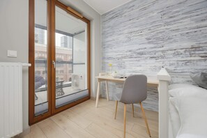 1 bedroom, desk, iron/ironing board, travel crib