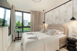 1 bedroom, desk, iron/ironing board, travel crib