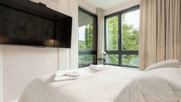 1 bedroom, desk, iron/ironing board, travel crib