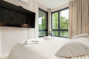 1 bedroom, desk, iron/ironing board, travel crib