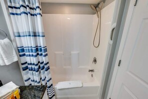 Shower, hair dryer, towels, shampoo