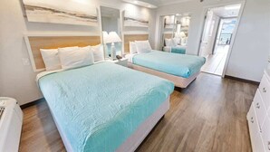 A hotel room with two beds, a wooden floor, a white wardrobe, and a balcony with a view. - New Direct Oceanfront, Pools Caravelle,HIGH Floor! (Myrtle Beach)