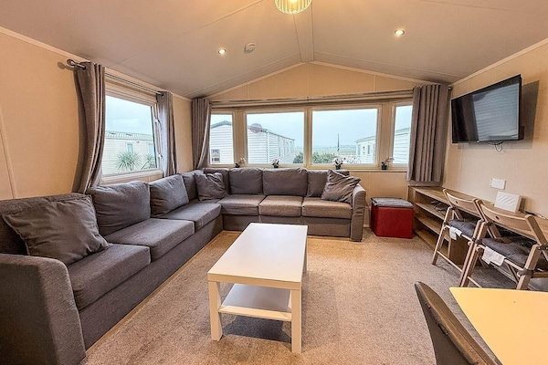 Enjoy the ultimate convenience and relaxation on the caravan decking. This extra outdoor space is perfect for morning coffees, al fresco dining or simply soaking up the sun.