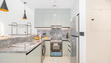 Coffee/tea maker, fridge, microwave, oven