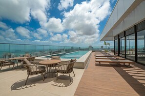 Indoor pool, pool umbrellas, pool loungers