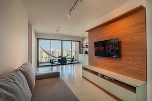 Family Apartment | Living area | 40-inch Smart TV with digital channels