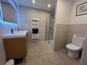 Shower, hair dryer, towels, soap