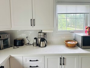 Fridge, microwave, stovetop, coffee/tea maker