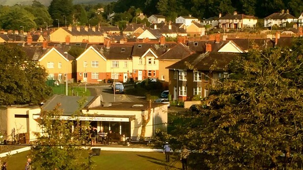 A residential area with houses, a lawn, and a building with a sign that reads "Bowling Club". - OYO Baytree Lodge (Bangor)