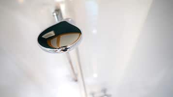 A close-up of a metallic object with a reflective surface, possibly part of a piece of furniture or equipment.