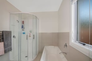Shower, hair dryer, towels, toilet paper