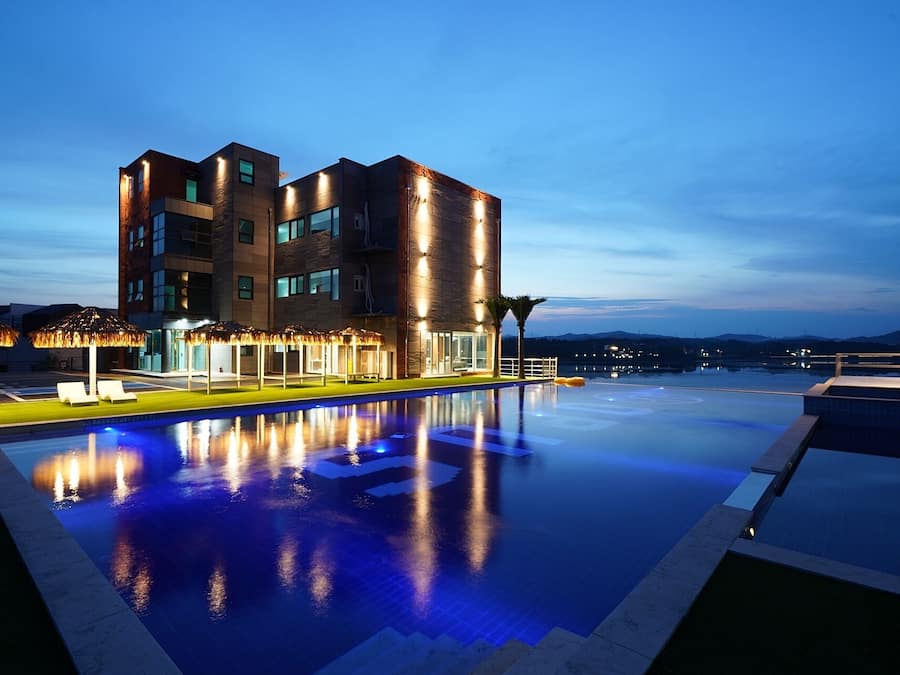 Seasonal outdoor pool, open 8:00 AM to 9:00 PM, pool umbrellas