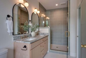 Shower, hair dryer, towels, shampoo