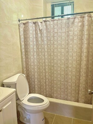 Shower, towels, soap, toilet paper