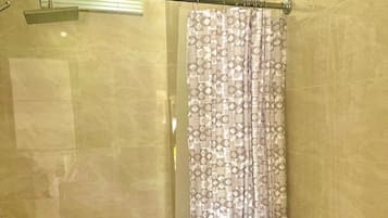 Shower, towels, soap, toilet paper