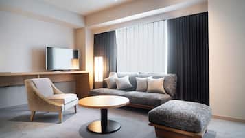 Family Studio Suite | Living area | 55-inch flat-screen TV with cable channels