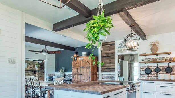 A spacious kitchen with a central island, wooden beams, and a farmhouse-style aesthetic. - The House of Proverbs-All about our Heavenly Father, Family and Good Fellowship! (Round Rock)