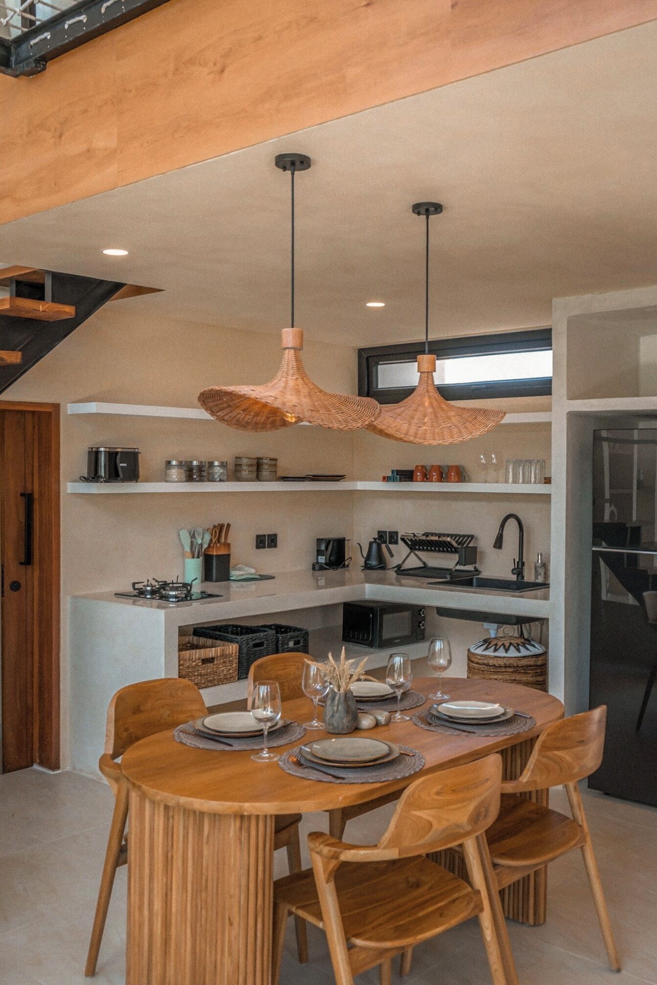 A modern kitchen with a dining area.