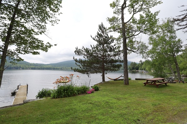Dock and picnic area with beautiful views at a lake house on Stinson Lake in the White Mountains
