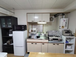 Fridge, microwave, cookware/dishes/utensils