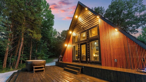 A modern cabin with a wooden deck, large windows, and a hot tub. - Romantic Sunsets Couples A Frame H/T Buffalo River (Parthenon)